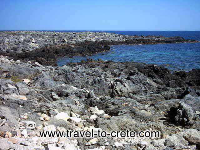 AKROTIRI STAVROS - The rocky left part of the bay