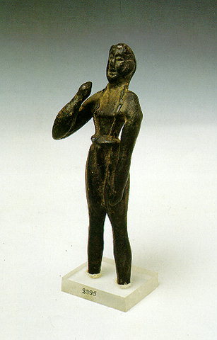 BRONZE FIGURINE - The large hall (84 x 38 m.) has an inclined floor and a small chamber opening to the left end; one of its niches is called the 