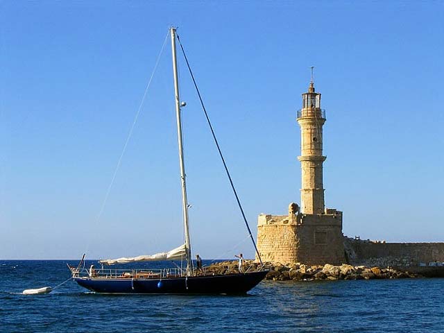 The old lighthouse at Chania's old port - The old lighthouse at Chania's old port is an all time classic shot. One from the many photos i took when i was there is this one. I liked a lot the view of the entrance of that boat in the port and the lighthouse. by Ilias Kapetanakis