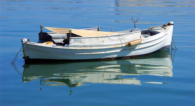 Fishing Boat - A fishing boat in Heraklion port at morning of August 15 by Oleg Kuznetsov