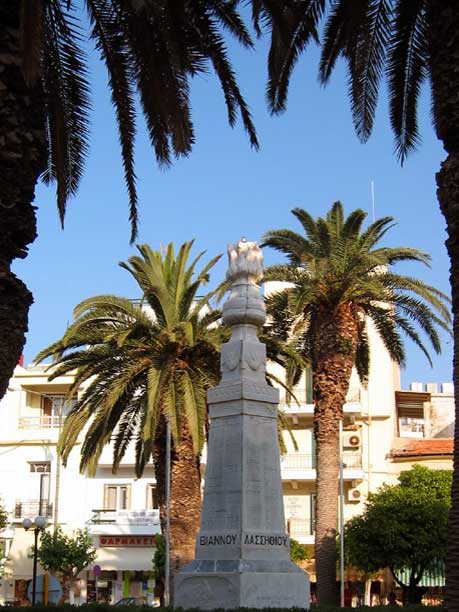 Statue - There was a little place in Agios Nikolaos with this statue, self framed with palm trees and all around the place there were some orange trees