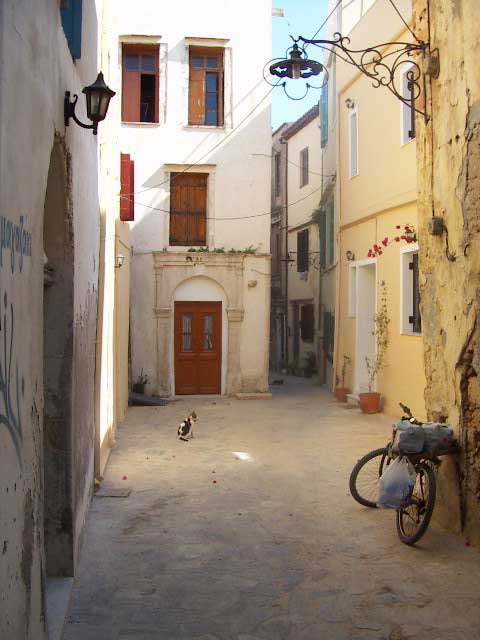 TRANQUILITY - An ordinary street in historic Chania. This city still has a lot of houses that date back to the time of the Venetian occupation. Take a step behind touristic lines and enter a world of small streets and porches where ordinary life continues in silence by hendrik de leyn