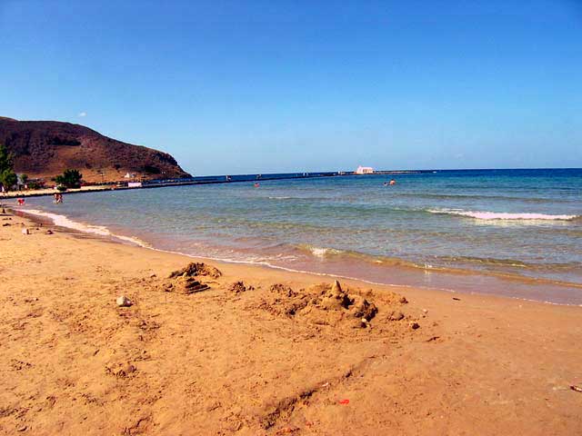 THE BEACH - The sandy beach of Georgioupolis. In the background the litle church at the the left edge of the beach.