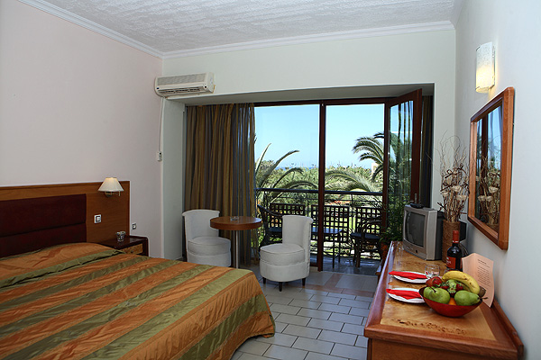 The pool of May beach Hotel surrounding landscape and the azure waters.