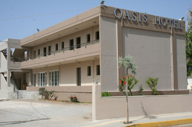 The swimming pool and the garden of Oasis Hotel