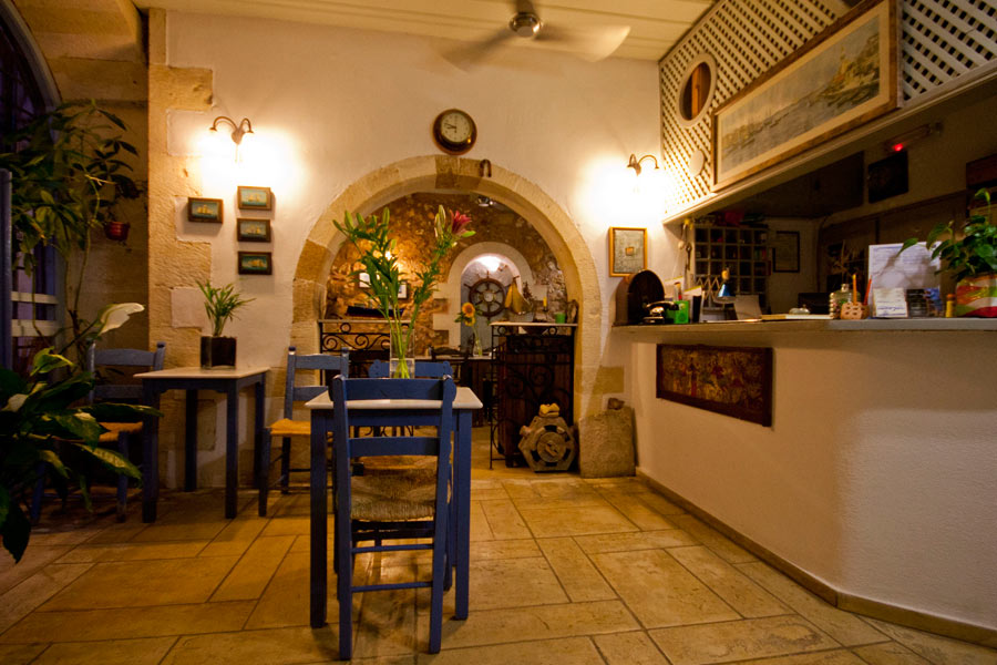 The brekfast room and the reception of Nostos Hotel