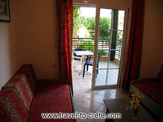 The livingroom and the veranda of Familly Apartments