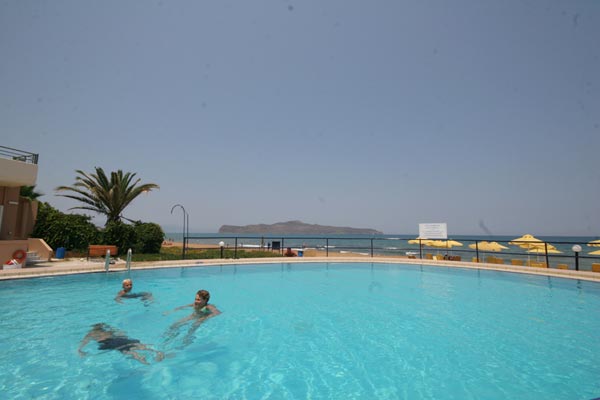 The room balcony of Phaedra Hotel is viewing the swimming  pool and the beach