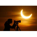Weather permitting, a partial solar eclipse will be visible in Greece next Monday, October 3.<br><br>

    The eclipse will be total for sections of Spain, Portugal and Africa and partial in Greece, with a maximum 57 per cent coverage of the sun's surface over Iraklio, Crete. <br><br>

    The phenomenon will begin on Crete at around 11:42 and reach its peak coverage at 12:40, ending after three hours at 14:11. <br><br>

    The eclipse will be observed by astronomy students at Crete University using a telescope with a special solar filter and through a telescope owned by the Crete University Physics Department, again equipped with a special solar filter. Both telescopes will be placed on the roof of the physics department, eight kilometres outside the city of Iraklio. <br><br>

    Scientists also warned that special glasses or other specialised equipment are needed in order to observe a solar eclipse and cautioned the public against using ordinary sunglasses, which do not provide adequate protection. They also noted that smoked glass, which is often used in order to observe an eclipse, does not block ultraviolet rays.
